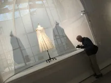 New York Times photographer Bill Cunningham - L’Eléphant Blanc dress by Yves Saint Laurent for his debut collection for the House of Dior